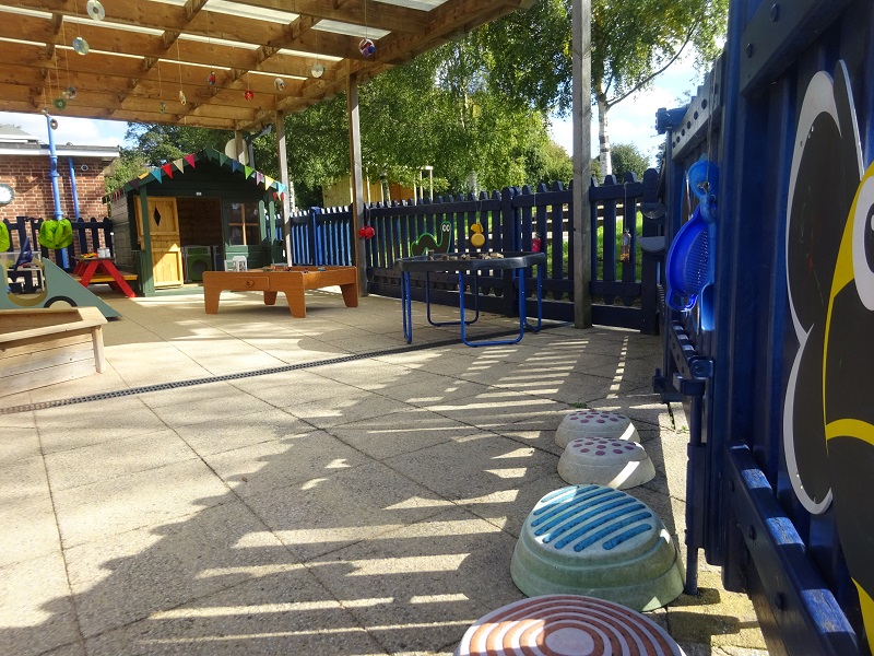 The enclosed outdoor area, with our little house in the background.